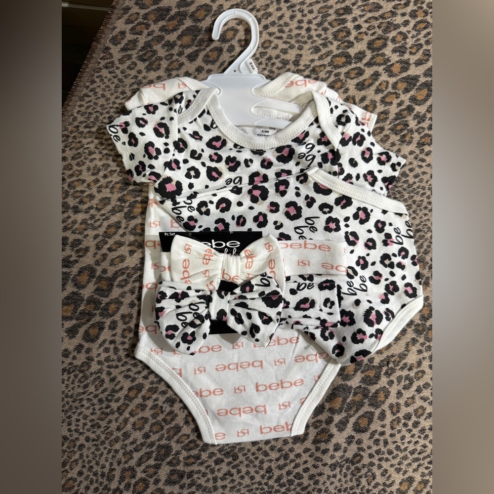 Bebe White and Pink Leopard Print Bodysuit